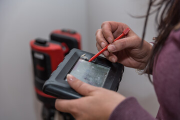 Craftswoman Uses Laser Gauge - 3-D Gauge Close-up