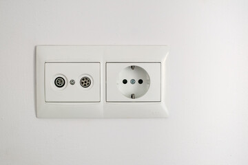 a white socket on the wall background