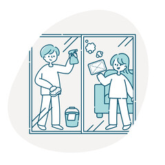 窓拭きをする夫婦