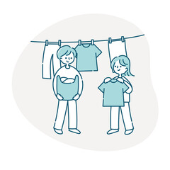 洗濯物を干す夫婦