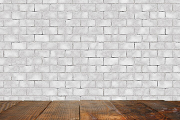 Vintage old brown wooden floor texture with white brick wall. Copy space background of interior decoration.
