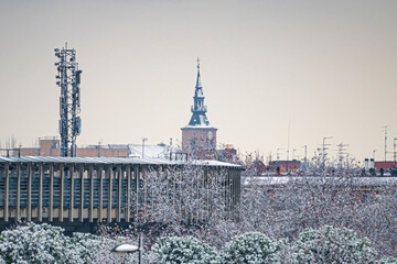 Bullring in the municipality of Getafe after a heavy snowfall, and roof of the Magdalena Cathedral