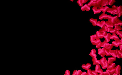  pink volumetric hearts on a black background. scattering of small hearts. High quality photo