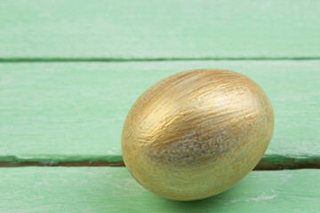 Happy Easter. Painted eggs on wooden table. Top view. Copy space for text.