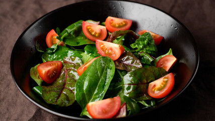 fresh salad with tomatoes, arugula, spinach, cheese parmesan close up. healthy lifestyle concept 