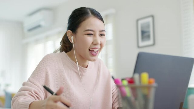 Young asian woman employee work from home using computer notebook videocall meeting conference angry annoy with low poor unreliable internet wifi connection problem issue outage.