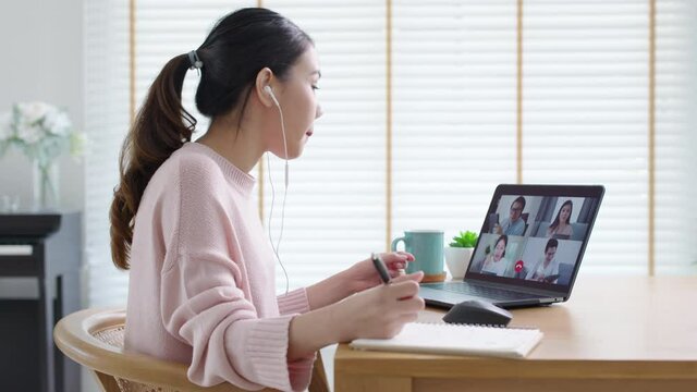 Side view young asian woman employee work from home using computer notebook videocall meeting conference angry annoy with low poor unreliable internet wifi connection problem issue outage.