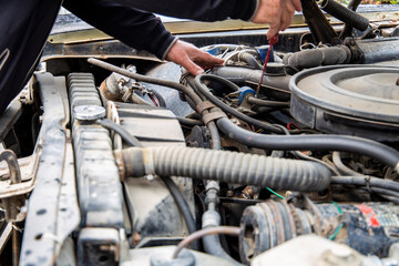Fototapeta na wymiar mechanic changing the engine of car