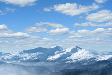 Fototapeta na wymiar Winter landscape with snow capped mountain peaks