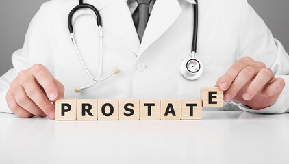Doctor holds wooden cubes in his hands with text Prostate