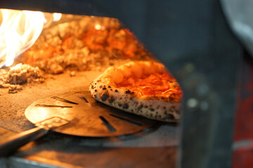 Neapolitan pepperoni pizza in wood-fired oven