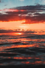 Sunset view of horizon at water level in ocean
