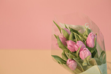 Tulips on a pink background for a Womens Day, Mother Day, 8 march or Valentines day. The concept of holidays and good morning wishes.