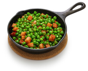 fresh green peas with ham in skillet isolated on white background