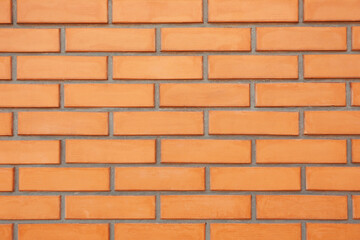 Texture of orange brick wall as background, closeup view