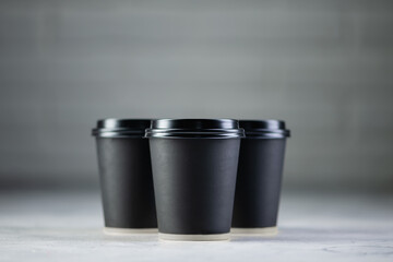 Paper cup of coffee on white background