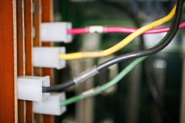 colorful power supply cables close up in a telecommunication cabinet