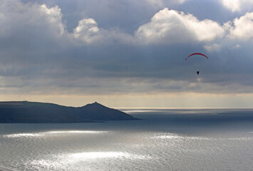 Storm Clouds and paraglider above Whitsand Bay, Cornwall	