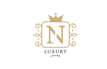 N simple yellow monogram alphabet letter logo. Creative icon design with king crown for luxury business and company