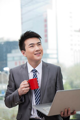 Businessman having an office coffee break
