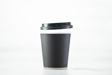 Paper cup of coffee on white background