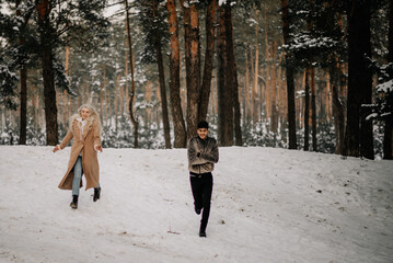 woman walking in winter forest