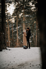 couple walking in the winter  woods