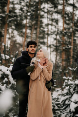 couple in winter forest