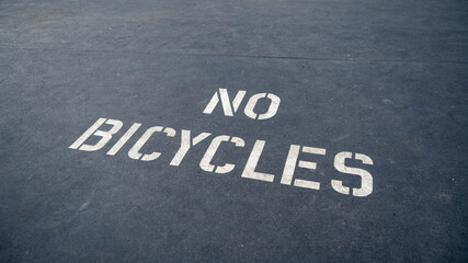 Fototapeta na wymiar No Bicycles warning painted on the road