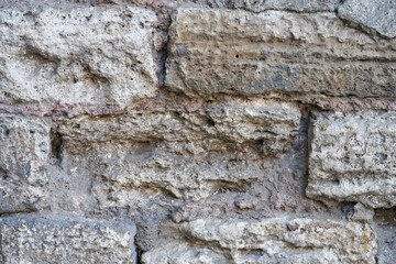 Old stone bricks wall texture close up