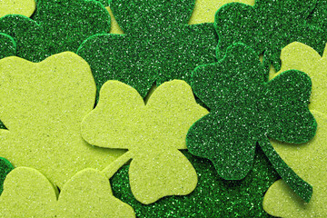 Decorative clover leaves as background, top view. St. Patrick's Day celebration