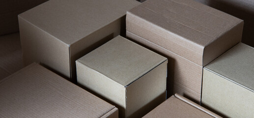 Carton backdrop made from cardboard boxes with geometric lines of shadow and boxes edges. recycle and reused concept.