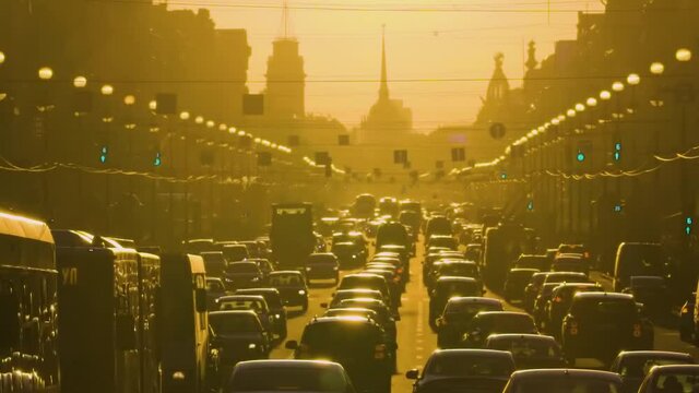 Heavy traffic on Nevsky Prospect in smog on a hot summer day. St. Petersburg, Russia. Long shot, frontal perspective, 60fps