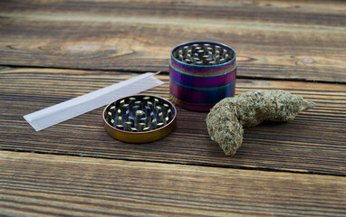 Medical Marijuana buds, weeds and grinder close up. Wooden backdround. Herbal medicine