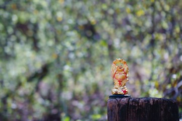 Buddha figure on a colored background.