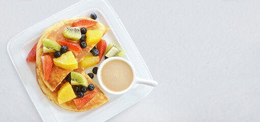 Waffles with fruits in plate on grey table, banner food - 407508571