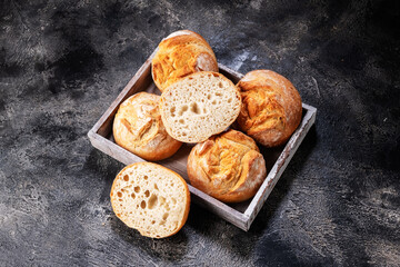 buns in a box on a wooden table