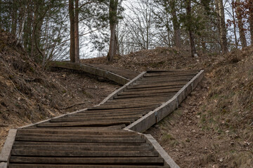 Fototapeta na wymiar outdoors wooden stairs to climb a hill