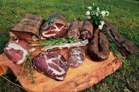 Selection of famous handmade Corsican specialities with finely sliced cold cuts of  coppa, wild boar sausage, Figatellu, Lonzu and Pancetta.
