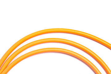 Obraz premium Orange USB rolled cable isolated on white background