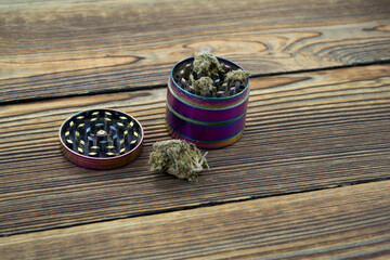 Grinder. A lot of marijuana, fresh buds of cannabis many weed. Copy-space