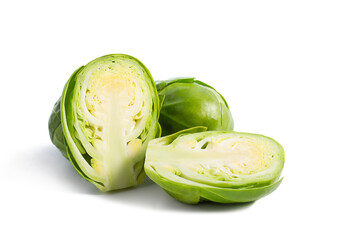 Brussels sprouts, one halved isolated on white background