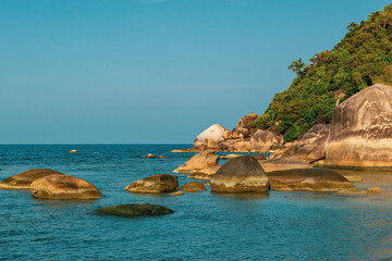 Thailand island landscape view of blue ocean and sky with rocks in the water and green jungles...