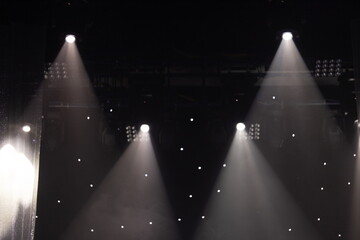 An empty stage of the theater, lit by spotlights and smoke before the performance	