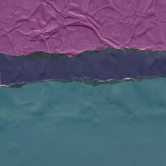 Colorful torn paper collage close-up. Texture made from various paper and cardboard parts. Damaged old paper background. Vintage blank wallpaper. Material design backdrop.