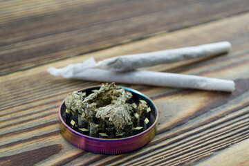 Grinder. A lot of marijuana, fresh buds of cannabis many weed. Copy-space