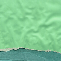 Colorful torn paper collage close-up. Texture made from various paper and cardboard parts. Damaged old paper background. Vintage blank wallpaper. Material design backdrop.