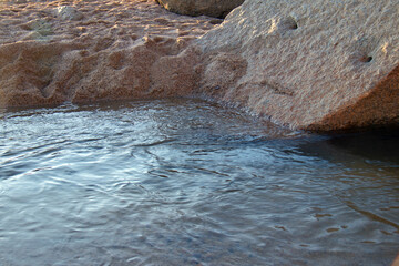 river water flowing into a lake