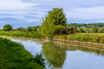A view across the Oxford Canal towards a Stent Pillbox close to the village of Napton, Warwickshire in summertime