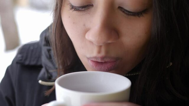 Satisfying Feeling Of Sipping Tea In Winter By A South Asian Woman 